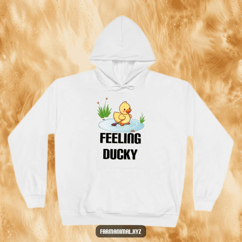 Funny duckling hoodie depicting a happy duckling paddling energetically in a pond, offering warmth and a symbol of cheerful contentment.