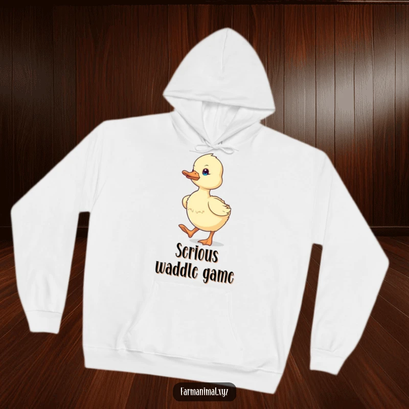 Funny determined duckling waddling with focus, printed on a soft hoodie, a humorous and motivational farm item.