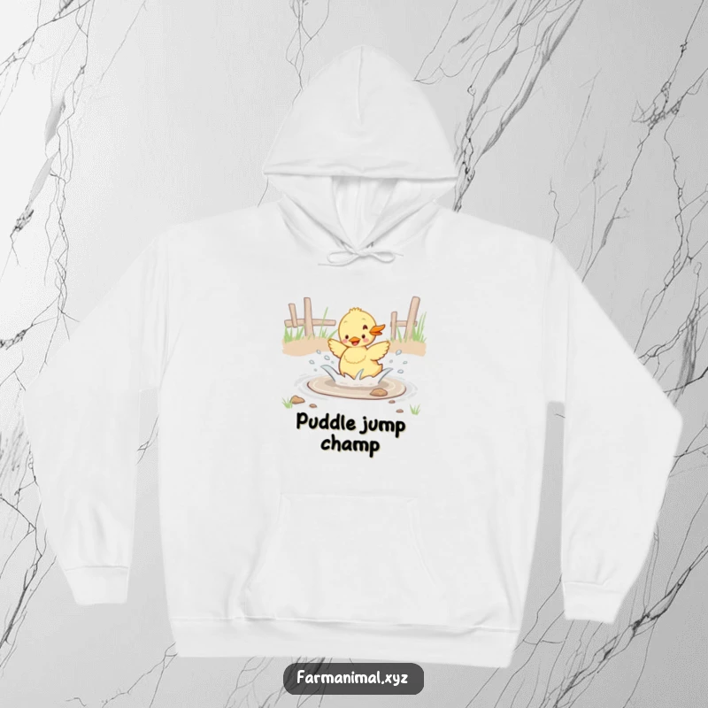 Funny duckling enthusiastically splashing in a barnyard puddle, a warm and humorous hoodie for cozy weather.