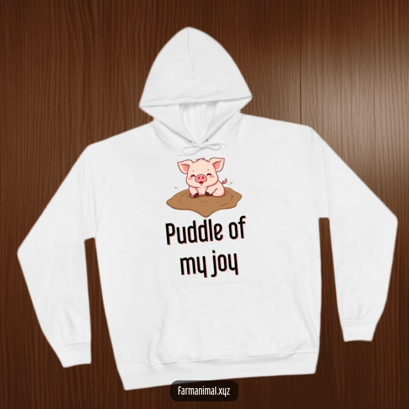 Funny hoodie showing a happy pig rolling in a heart-shaped mud puddle, perfect for cozy fun.