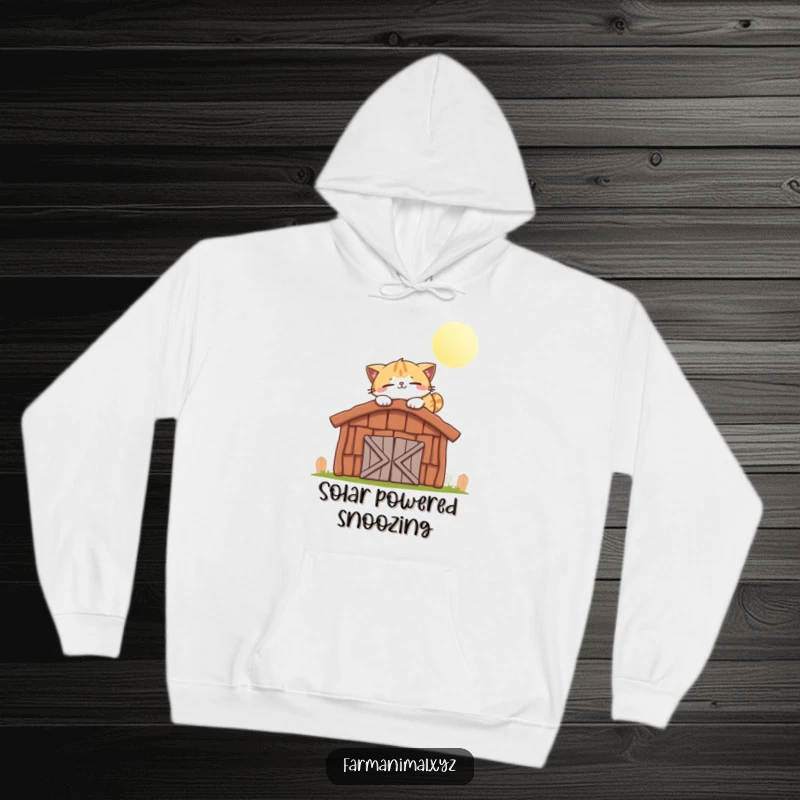 Funny cat hoodie showing a smiling cat character happily napping on a warm, sunlit barn roof.